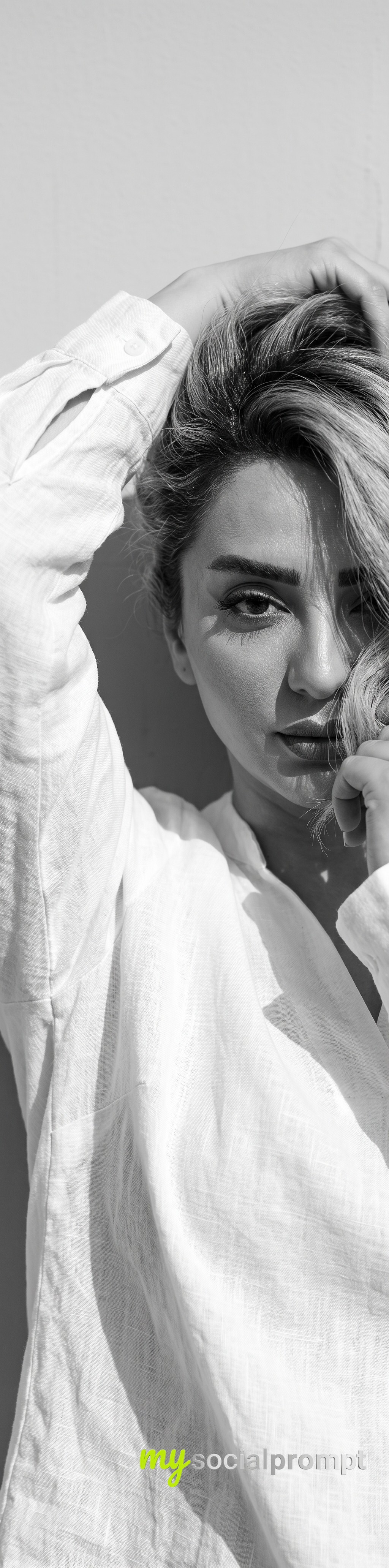 Monochrome High-Fashion Editorial Portrait with Dramatic Shadow Play